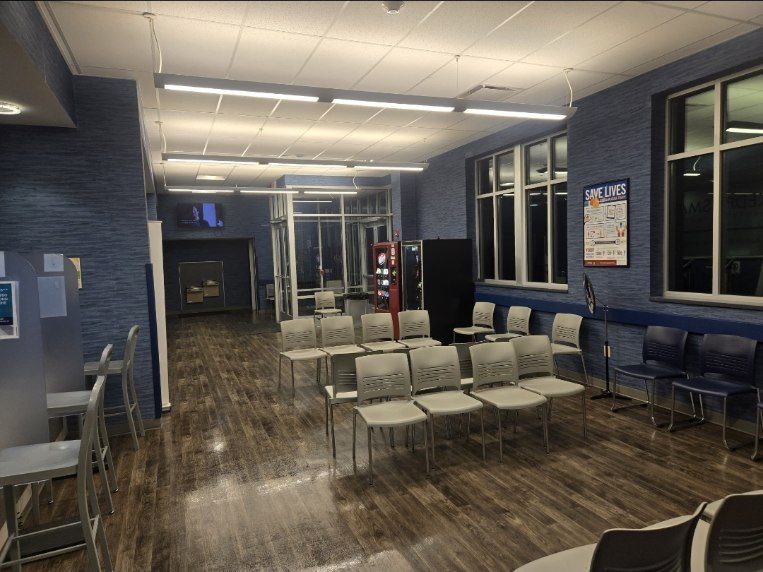Clinic waiting area cleaned after hours, chairs reset and floors mopped