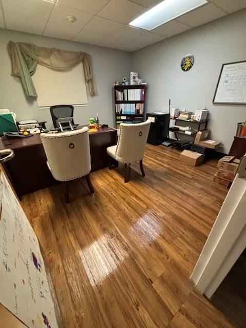 Private office cleaned with hardwood floor mopped and polished by AICS